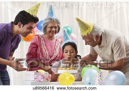 Stock Photograph - Family celebrating birthday. Fotosearch