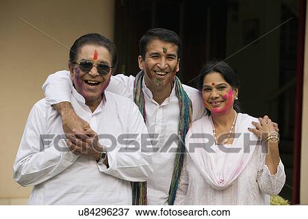 Stock Photo - Family celebrating Holi . Fotosearch