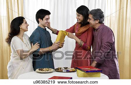 Stock Photo - Family celebrating Rakhi . Fotosearch