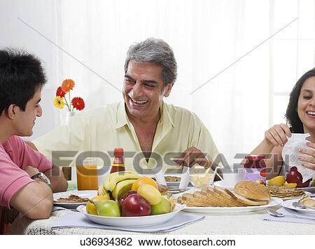 Family having breakfast View Large Photo Image Stock Image - Family having breakfast . Fotosearch