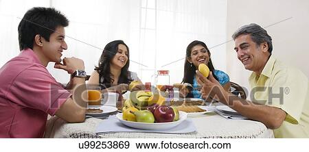 Family having breakfast View Large Photo Image Stock Photo - Family having breakfast . Fotosearch