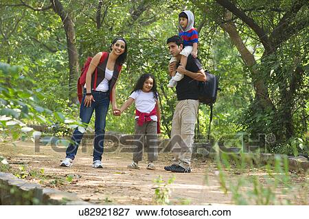 Family in a park View Large Photo Image Stock Photo - Family in a park . Fotosearch
