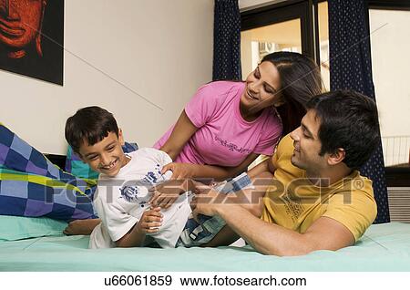 Family in a playful mood View Large Photo Image Stock Photo - Family in a playful mood . Fotosearch