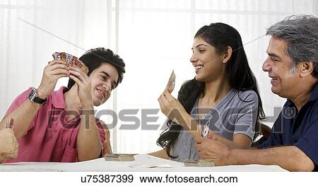 Family playing cards View Large Photo Image Stock Photo - Family playing cards . Fotosearch
