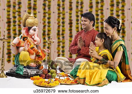 Family praying View Large Photo Image Stock Photo - Family praying . Fotosearch