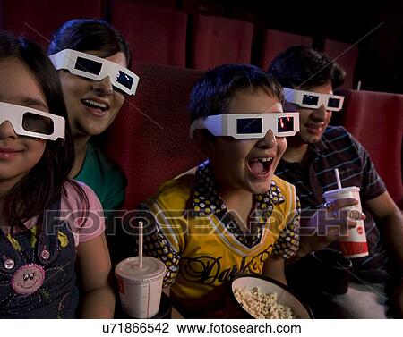 Family watching a movie with 3D glasses View Large Photo Image Stock Image - Family watching a movie with 3D glasses . Fotosearch
