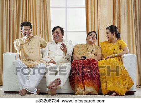 Family watching television View Large Photo Image Picture - Family watching television . Fotosearch