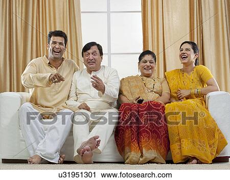 Family watching television View Large Photo Image Stock Image - Family watching television . Fotosearch