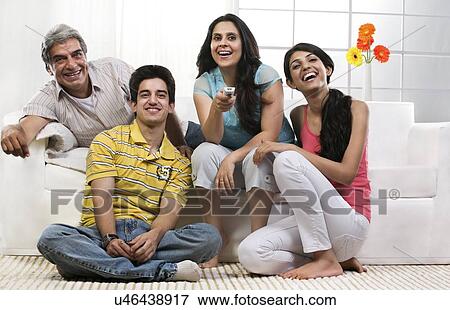 Family watching television View Large Photo Image Stock Photo - Family watching television . Fotosearch