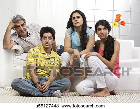 Family watching television View Large Photo Image Stock Photo - Family watching television . Fotosearch