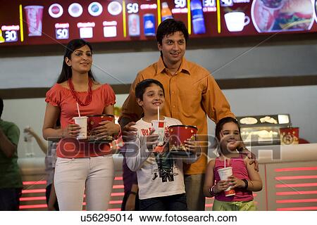 Family with cola and popcorn View Large Photo Image Picture - Family with cola and popcorn . Fotosearch