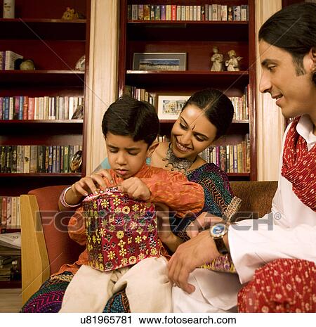 Family with gifts on Diwali View Large Photo Image Stock Image - Family with gifts on Diwali . Fotosearch