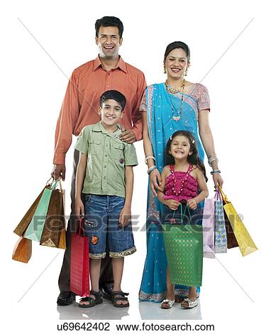 Stock Image - Family with shopping bags . Fotosearch