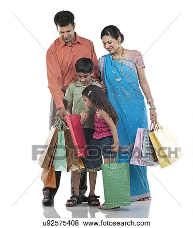 Family with shopping bags View Large Photo Image Stock Photo - Family with shopping bags . Fotosearch
