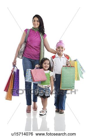Stock Photograph - Family with shopping bags . Fotosearch