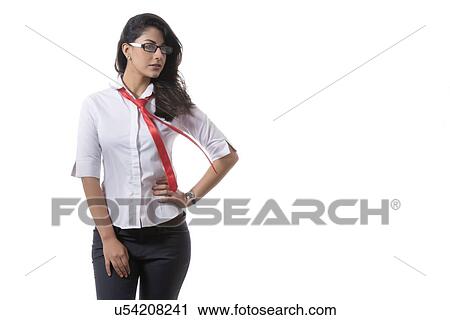 Fashionable businesswoman standing with hand on hip against white background View Large Photo Image Stock Image - Fashionable businesswoman standing with hand on hip against white background. Fotosearch