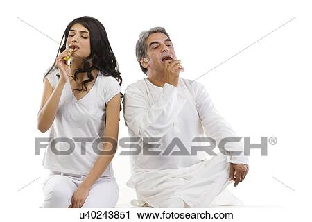 Father and daughter eating chocolate View Large Photo Image Stock Image - Father and daughter eating chocolate . Fotosearch