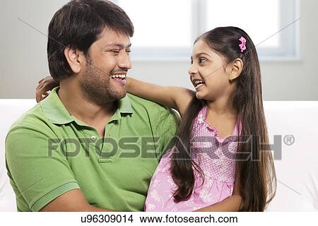 Father and daughter enjoying View Large Photo Image Picture - Father and daughter enjoying . Fotosearch