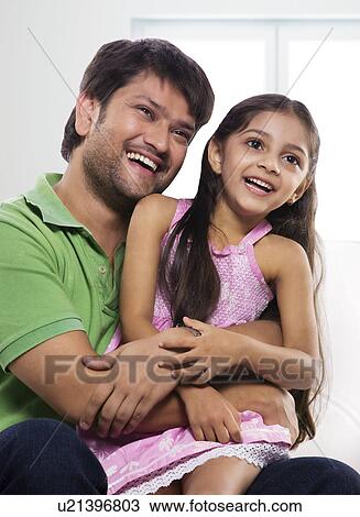 Stock Image - Father and daughter enjoying . Fotosearch