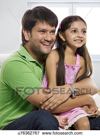 Stock Photo - Father and daughter enjoying . Fotosearch