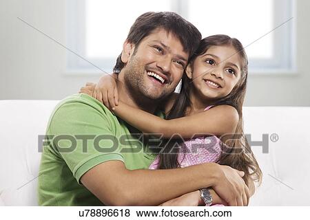 Stock Photo - Father and daughter enjoying . Fotosearch