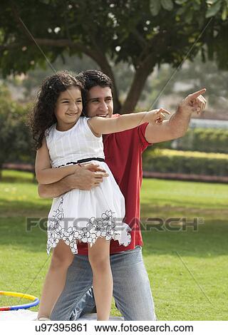 Father and daughter pointing View Large Photo Image Stock Image - Father and daughter pointing . Fotosearch