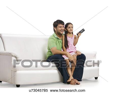 Father and daughter watching television View Large Photo Image Stock Photography - Father and daughter watching television . Fotosearch