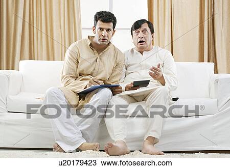 Father and son watching television View Large Photo Image Stock Image - Father and son watching television . Fotosearch