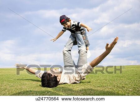 Father playing with his son View Large Photo Image Picture - Father playing with his son . Fotosearch