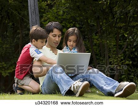 Stock Photo - Father with his kids . Fotosearch