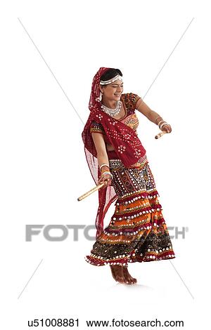 Female dandiya dancer dancing with sticks View Large Photo Image Stock Image - Female dandiya dancer dancing with sticks . Fotosearch