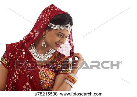 Stock Photo - Female dandiya dancer . Fotosearch