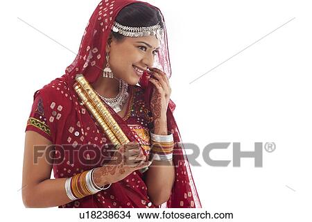 Female dandiya dancer with sticks View Large Photo Image Picture - Female dandiya dancer with sticks . Fotosearch