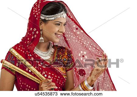 Female dandiya dancer with sticks View Large Photo Image Stock Image - Female dandiya dancer with sticks . Fotosearch