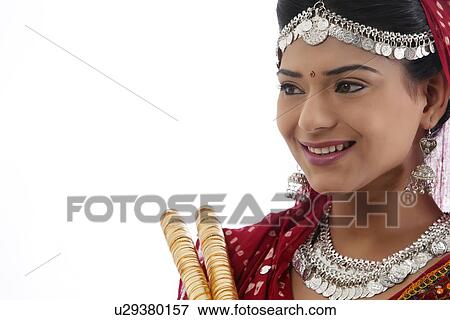 Female dandiya dancer with sticks View Large Photo Image Stock Photo - Female dandiya dancer with sticks . Fotosearch
