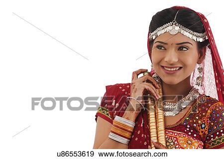 Female dandiya dancer with sticks View Large Photo Image Stock Photo - Female dandiya dancer with sticks . Fotosearch
