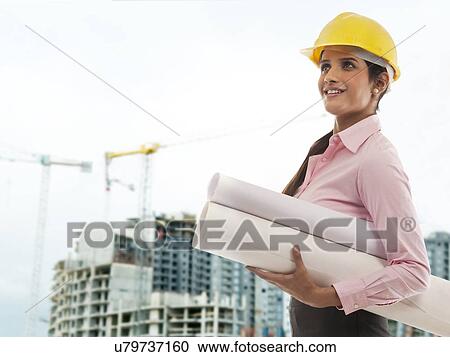 Female engineer with blueprints View Large Photo Image Stock Image - Female engineer with blueprints . Fotosearch