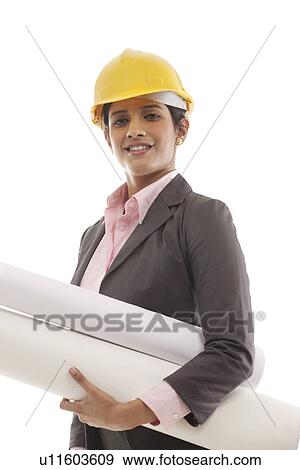 Stock Photo - Female engineer with blueprints . Fotosearch