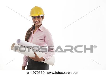 Stock Photo - Female engineer with blueprints . Fotosearch