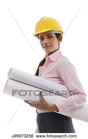 Stock Photograph - Female engineer with blueprints . Fotosearch