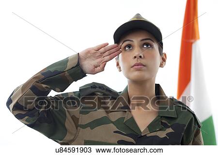 Female soldier saluting while looking up and Indian flag in background View Large Photo Image Stock Image - Female soldier saluting while looking up and Indian flag in background . Fotosearch