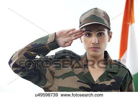 Stock Photo - Female soldier saluting with Indian flag in background . Fotosearch