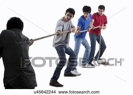 Friends competing in game of tug of war together over white background View Large Photo Image Picture - Friends competing in game of tug of war together over white background . Fotosearch