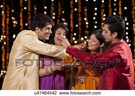 Friends eating sweets View Large Photo Image Stock Image - Friends eating sweets. Fotosearch