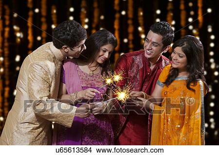 Friends playing with firecrackers View Large Photo Image Picture - Friends playing with firecrackers. Fotosearch