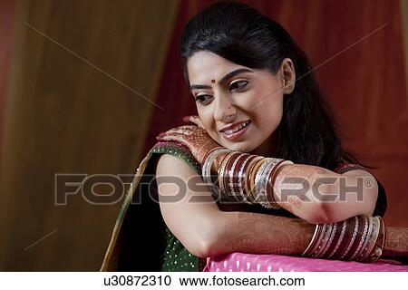 Front view of smiling young Indian bride View Large Photo Image Stock Image - Front view of smiling young Indian bride . Fotosearch
