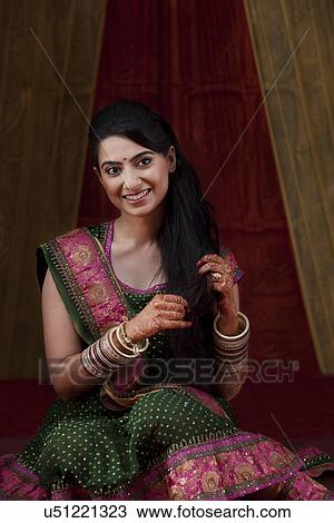 Front view of smiling young Indian bride View Large Photo Image Stock Image - Front view of smiling young Indian bride . Fotosearch