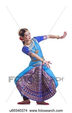 Picture - Full length of beautiful woman performing Bharatanatyam on white background. Fotosearch