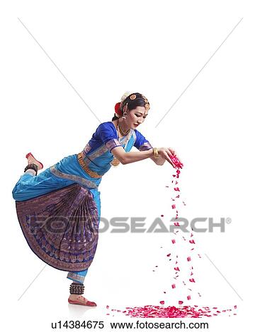 Full length of Bharatanatyam dancer dropping rose petals over white background View Large Photo Image Stock Photography - Full length of Bharatanatyam dancer dropping rose petals over white background. Fotosearch