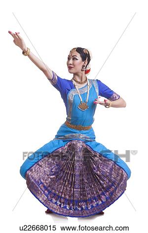 Stock Photography - Full length of dancer performing Bharatanatyam against white background. Fotosearch